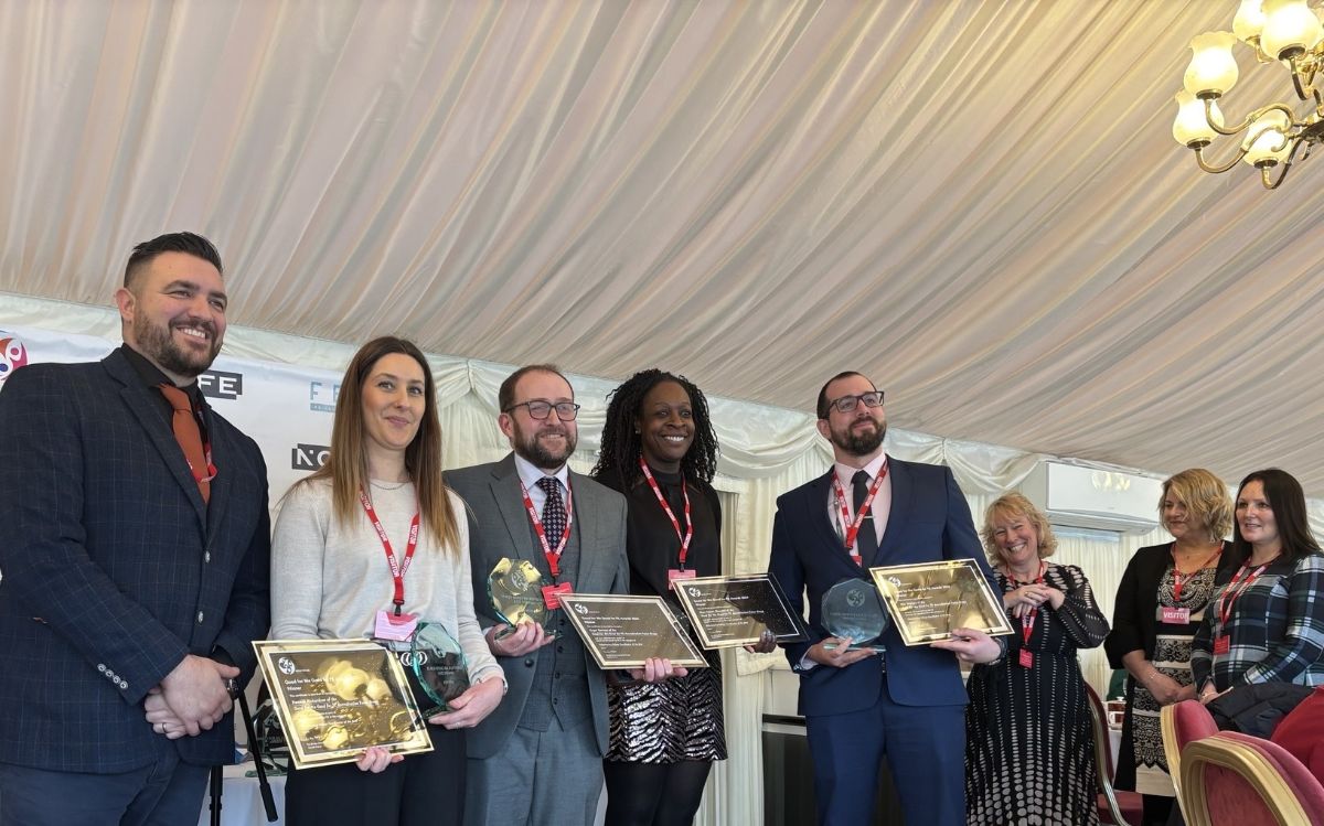 SERC's Roger Duncan (third from left) with his colleagues receiving their award for encouraging volunteering in FE colleges. 